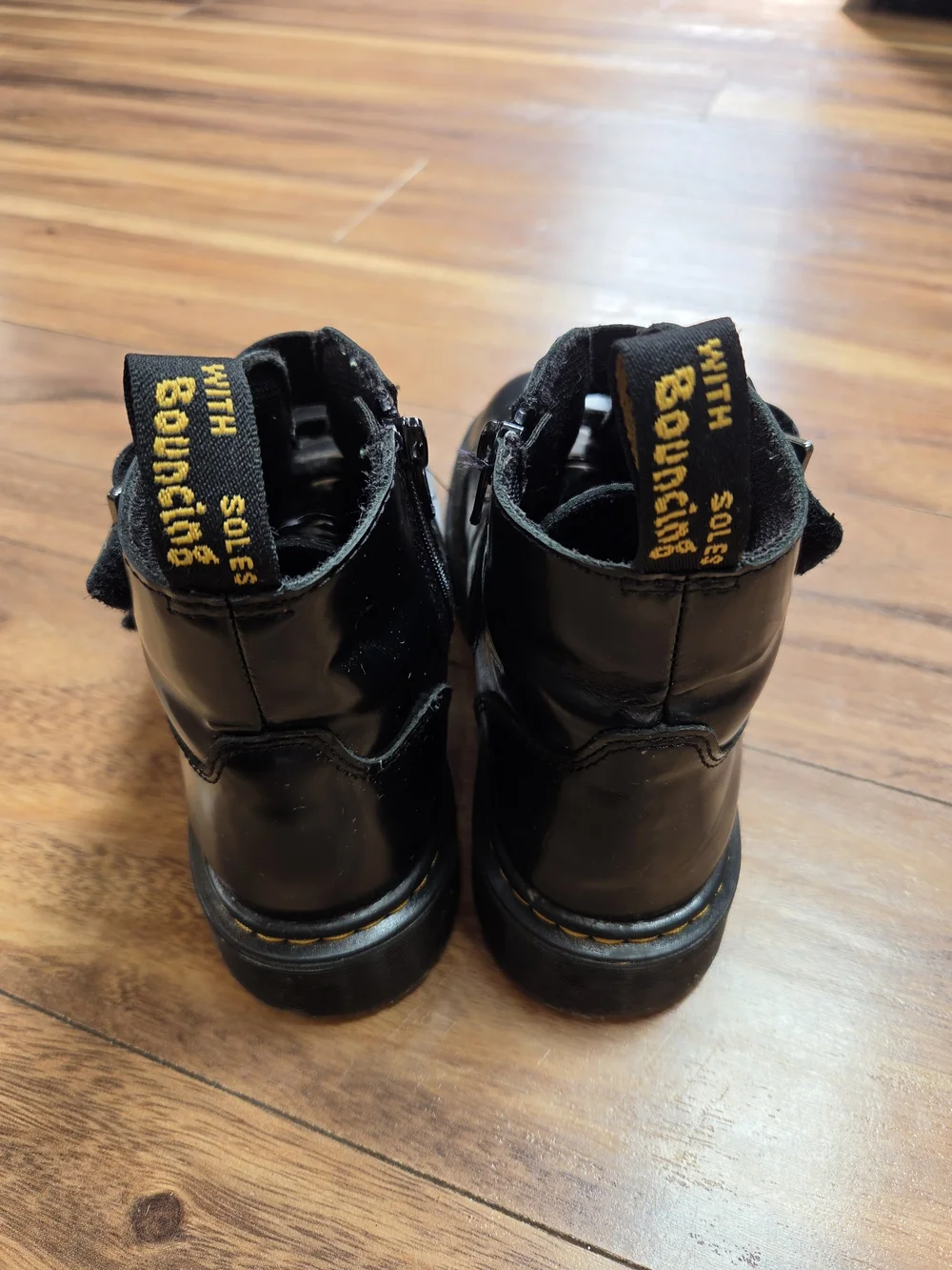 Dr. Martens Kids Black Leather Star Buckle Ankle Boots